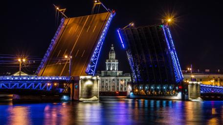 Stunning Night View of a City Bridge Raising wallpaper