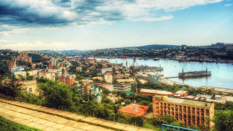 Scenic Cityscape with Waterway View in Vibrant Colors wallpaper