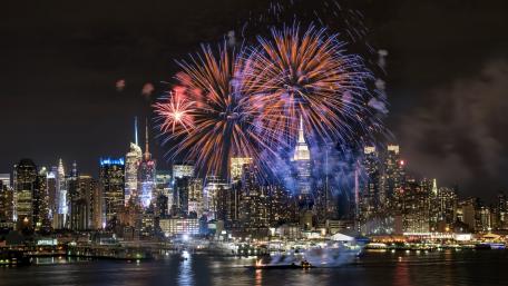 Vibrant Night Celebrations Over the Cityscape wallpaper