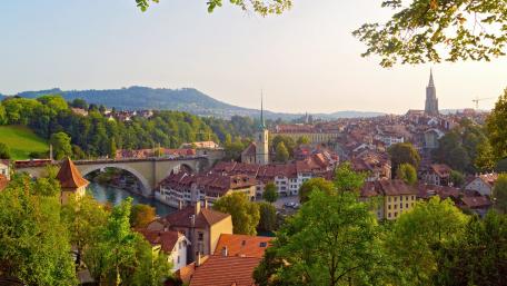 Charming Cityscape Overlooking a Serene River wallpaper