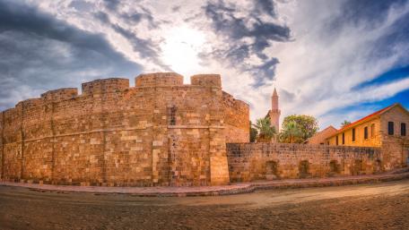 Ancient Fortress Under Dramatic Skies wallpaper