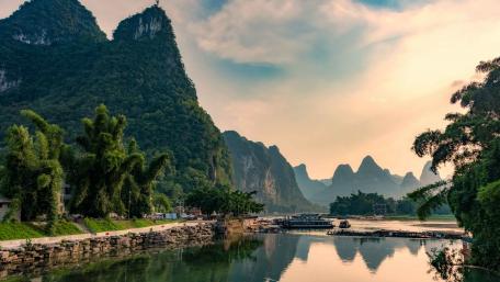 Serene Waters and Majestic Mountains in Nature's Embrace wallpaper
