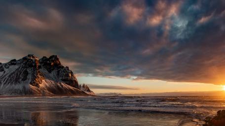Majestic Mountain Meets Tranquil Ocean Landscape wallpaper