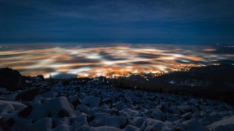 City Lights Above the Clouds at Night wallpaper