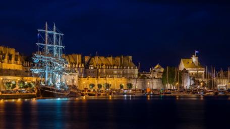 Captivating Nightview of a Historic Coastal City wallpaper