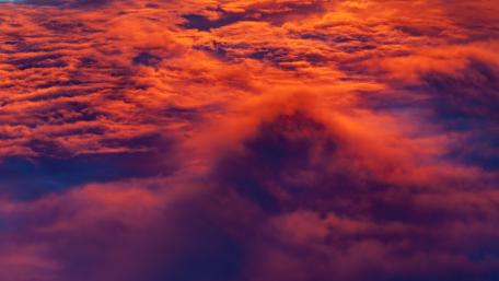 Fiery Sunset Above the Clouds wallpaper