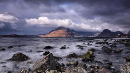 Majestic Coastal Landscape Under Dramatic Skies wallpaper