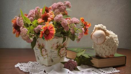 Charming Floral Arrangement with Sheep Figurine wallpaper