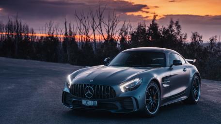 Sleek Luxury Against a Stunning Sunset wallpaper