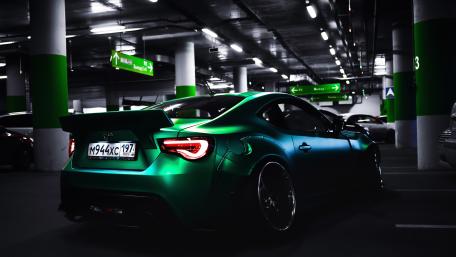 Sleek Toyota Sports Car in Shadowy Garage wallpaper