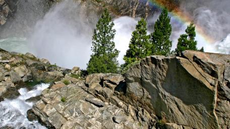 Majestic Waterfall with a Vibrant Rainbow wallpaper