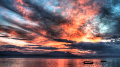 Vibrant Sunset Over Tranquil Lake Scene wallpaper
