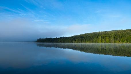 Tranquil Blue Reflections of Nature's Serenity wallpaper