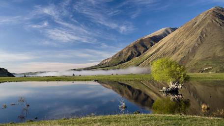 Serene Mountain Reflection Over Tranquil Lake wallpaper