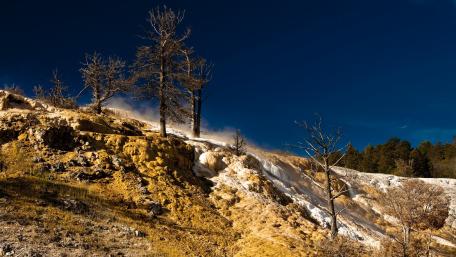 Majestic Winter Landscape Under Blue Skies wallpaper