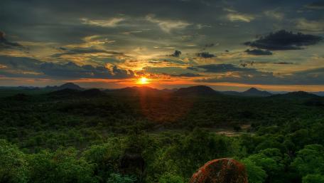 Sunset Serenity Over Verdant Hills wallpaper