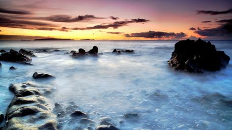 Tranquil Sunset Over Serene Coastline wallpaper