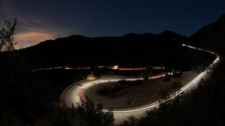 Curvy Road Under Starry Night Sky wallpaper
