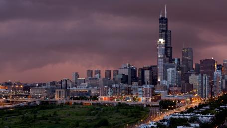 Stunning City Skyline Under Dramatic Skies wallpaper