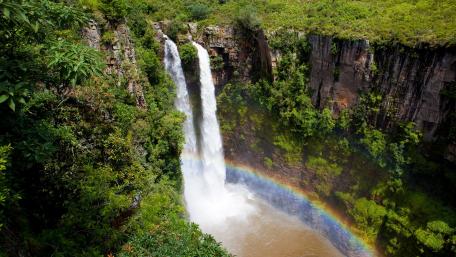Majestic Waterfall and Vibrant Rainbow Landscape wallpaper