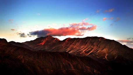 Majestic Mountains Under a Colorful Sky wallpaper