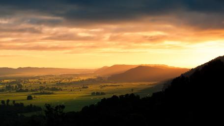 Golden Sunrise Over Rolling Hills wallpaper