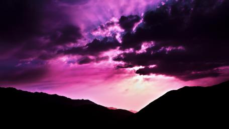 Purple Sunset over Majestic Mountains wallpaper