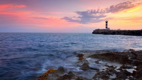 Serene Sunset by the Lighthouse wallpaper