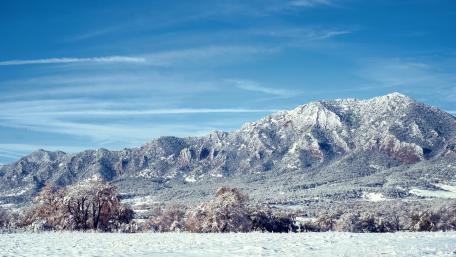 Serene Winter Mountain Landscape Under Blue Sky wallpaper