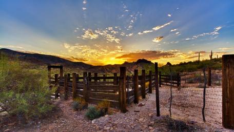 Serene Desert Sunset Overlooking Scenic Landscape wallpaper