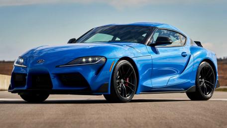 Sleek Blue Toyota supra A90 Gleaming Under Open Skies wallpaper