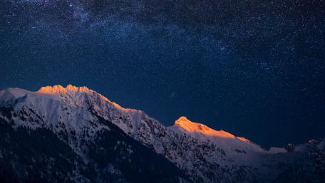 Majestic Peaks Under the Starlit Sky wallpaper