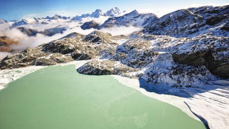 Serene Snowy Mountain Landscape with Calm Lake wallpaper