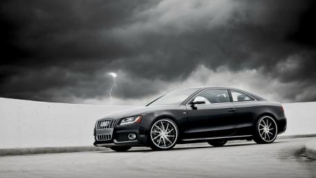 Stormy Audi Under Dark Clouds wallpaper
