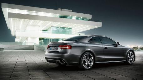 Sleek Audi Under Urban Night Lights wallpaper