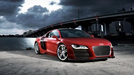 Sleek Red Audi R8 Under Dramatic Skies wallpaper
