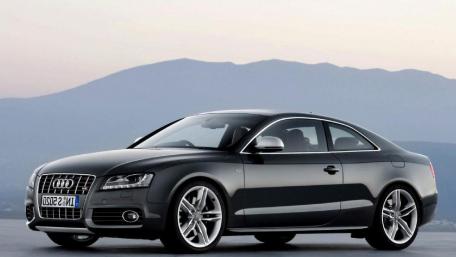 Sleek Audi A4 in a Serene Landscape wallpaper