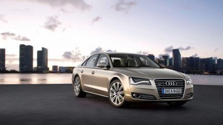 Sleek Audi A8 Against City Skyline wallpaper