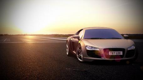 Sleek Audi R8 on a Sunset Road wallpaper