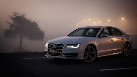 Sleek Audi S8 Gliding Through Misty Roads wallpaper