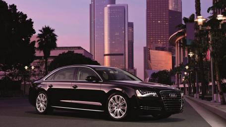 Sleek Audi in Urban Twilight Scene wallpaper