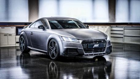 Sleek Audi TT in a Modern Workshop Setting wallpaper