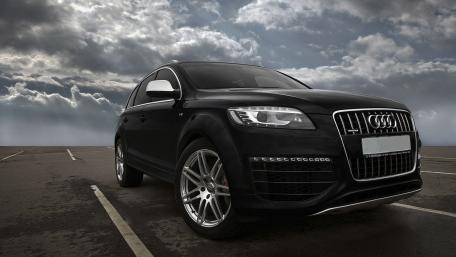 Sleek Audi SUV Under Dramatic Sky wallpaper