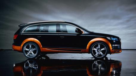 Sleek Audi SUV on an Urban Night Drive wallpaper