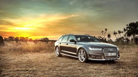 Sleek Audi Under a Stunning Sunset wallpaper