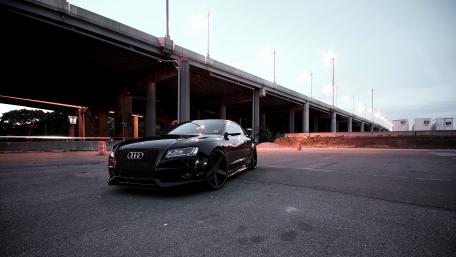 Sleek Audi in Urban Nightscape Artwork wallpaper