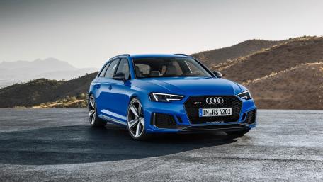 Sleek Audi RS4 in Scenic Landscape wallpaper