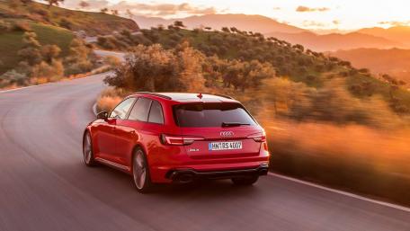 Dynamic Audi Driving Through Scenic Landscape wallpaper