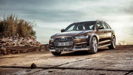 Sleek Audi A6 on a Scenic Landscape wallpaper
