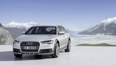 Sleek Audi A6 in a Scenic Mountain Landscape wallpaper